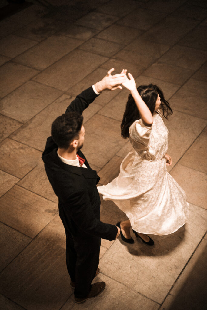 young-man-holding-hand-whirling-elegant-woman